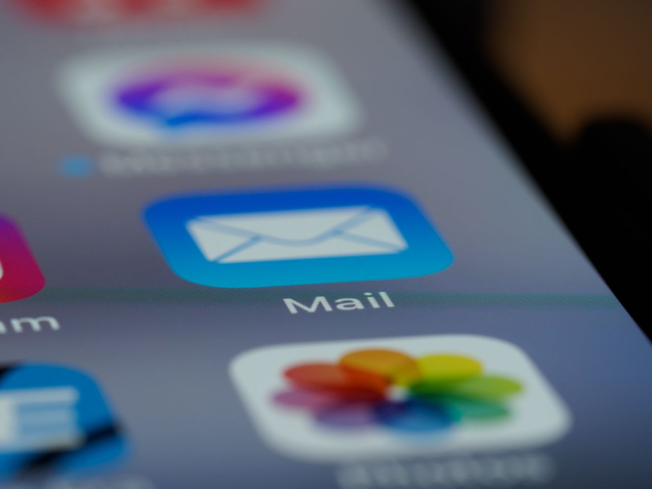 contact-img Detailed close-up of an email app icon on a smartphone screen, showcasing modern technology.
